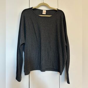 Gray crew neck long sleeve sweater with black striped sleeve